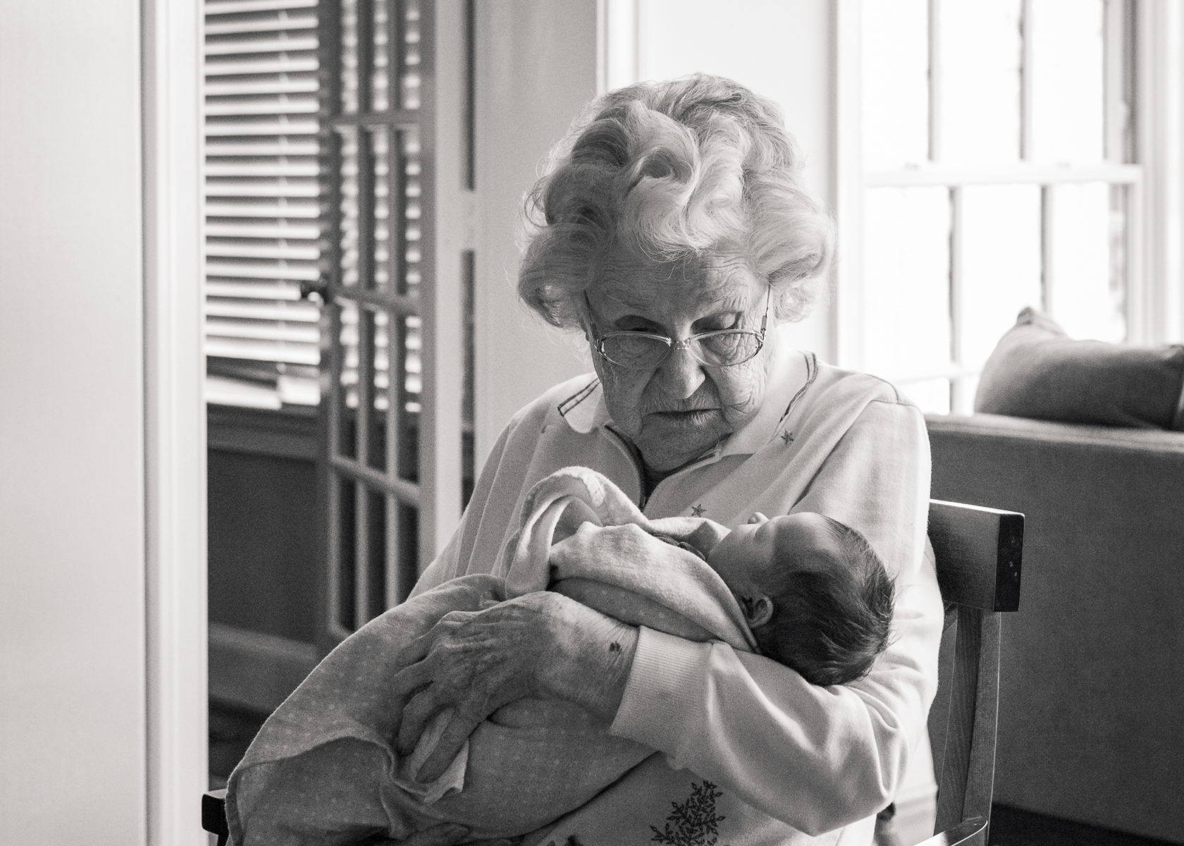 great grandmother holding newborn