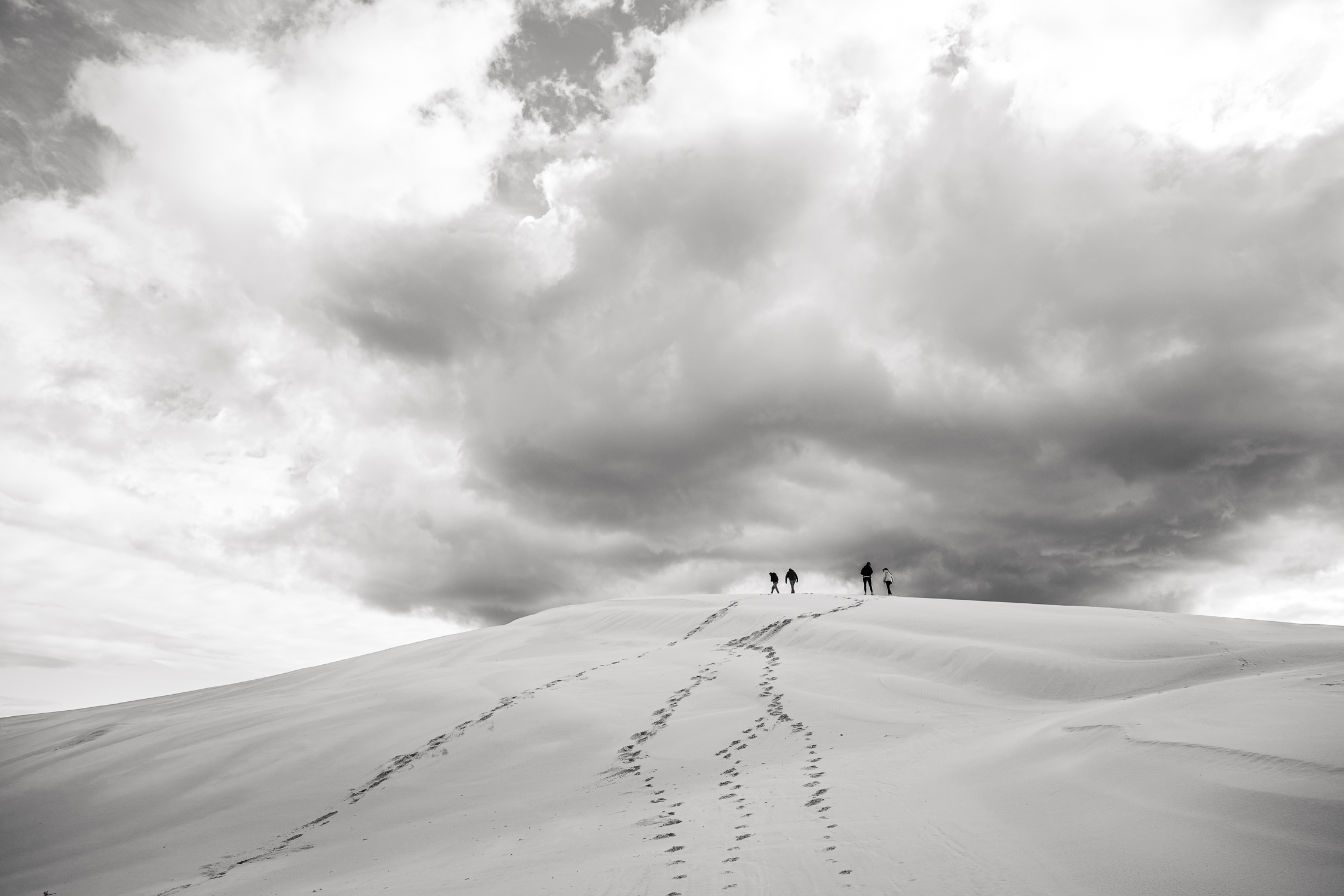 FarFar-22 four figures silhouetted on the Great Dune in Australia