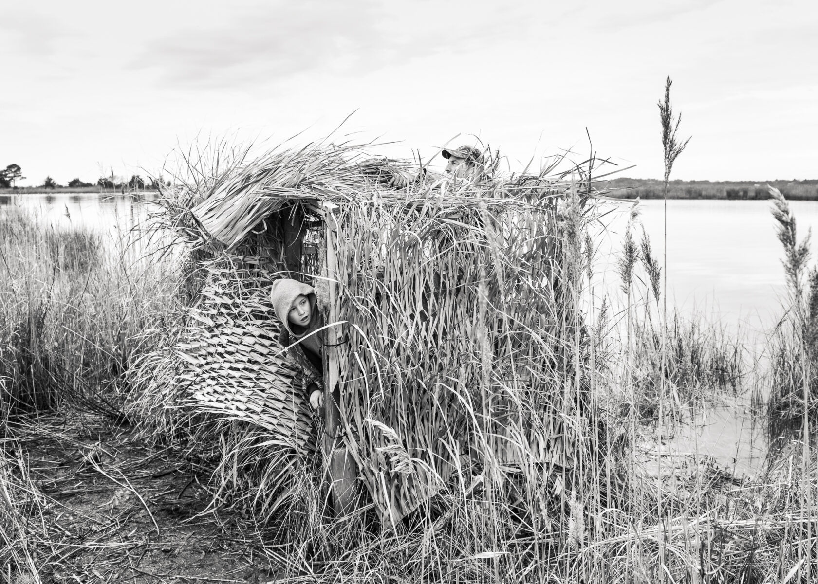 child hiding in duck blind