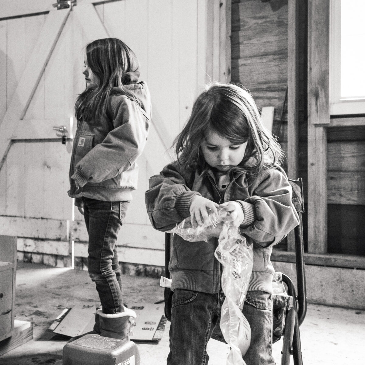 children in outbuilding preparing for hunting season