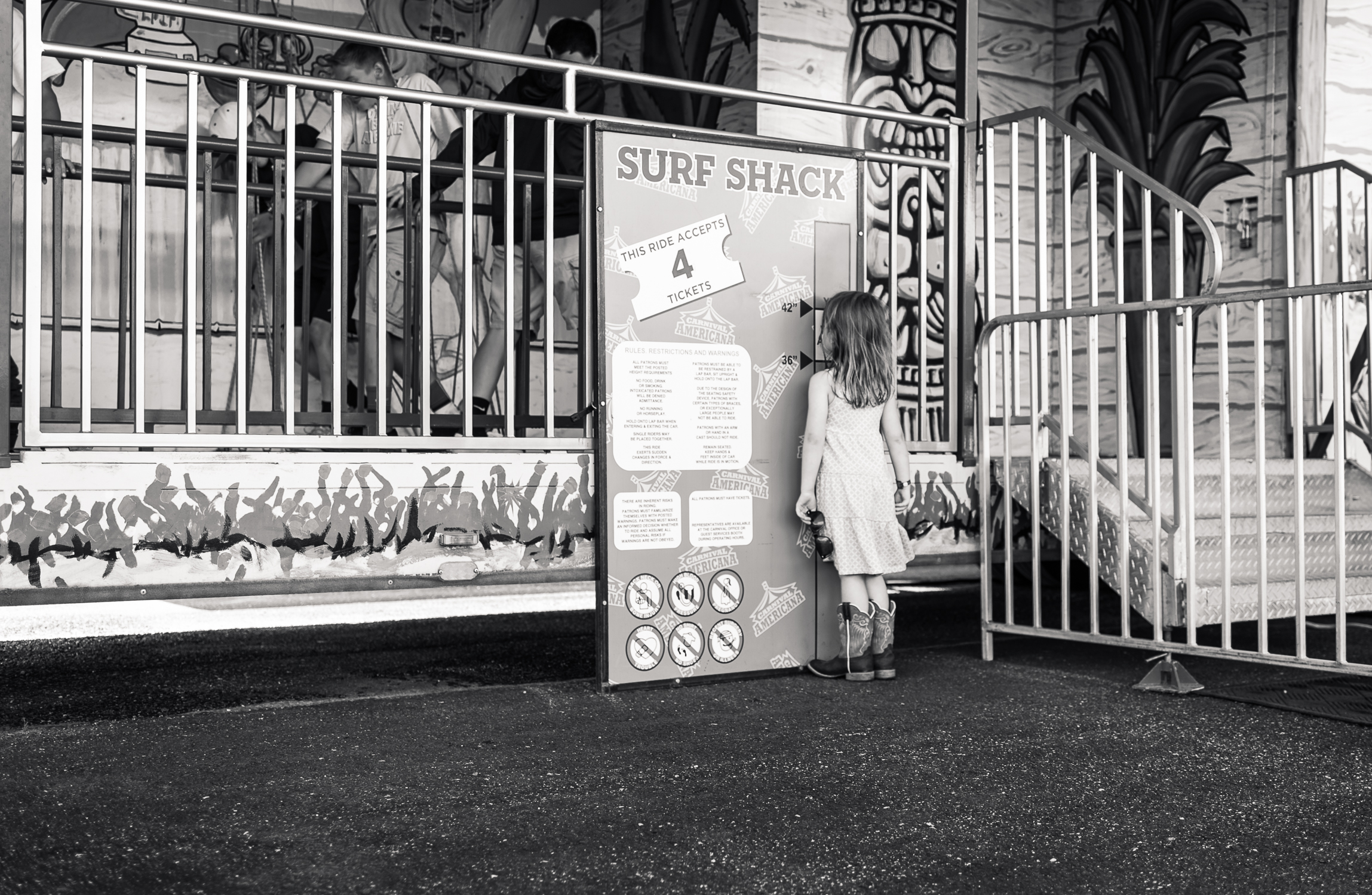 LikeAGirl-7 girl measuring herself at carnival ride